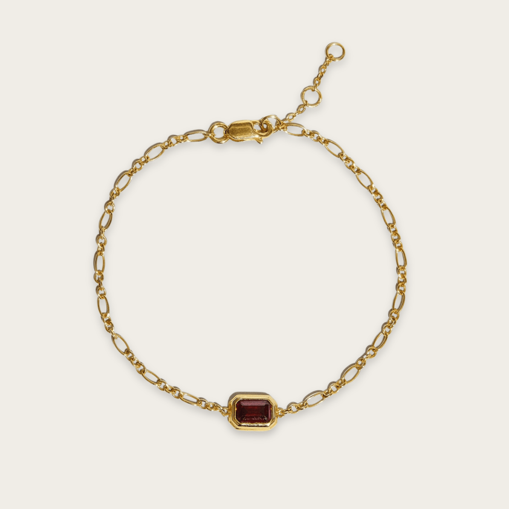 Pulsera elegante de oro con piedras semipreciosas de esmeralda y rubí