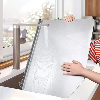 STEELCUT PRO - Tagliere in acciaio inox con base antiscivolo e labbro integrato